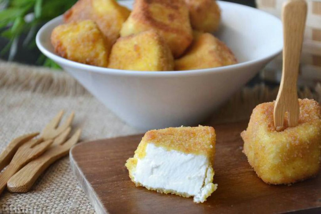 Ricotta fritta in pastella: croccante fuori e morbida dentro per un aperitivo irresistibile